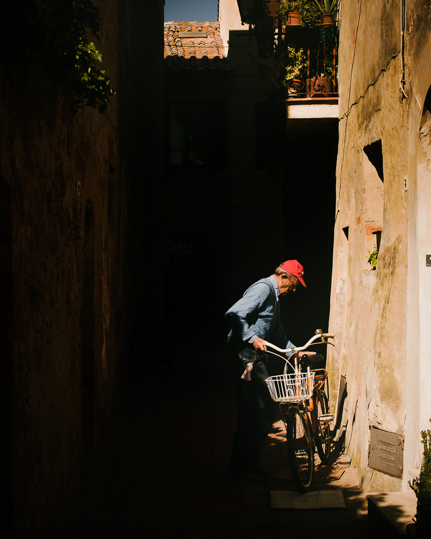 Pienza Cyclist by Adam Lack